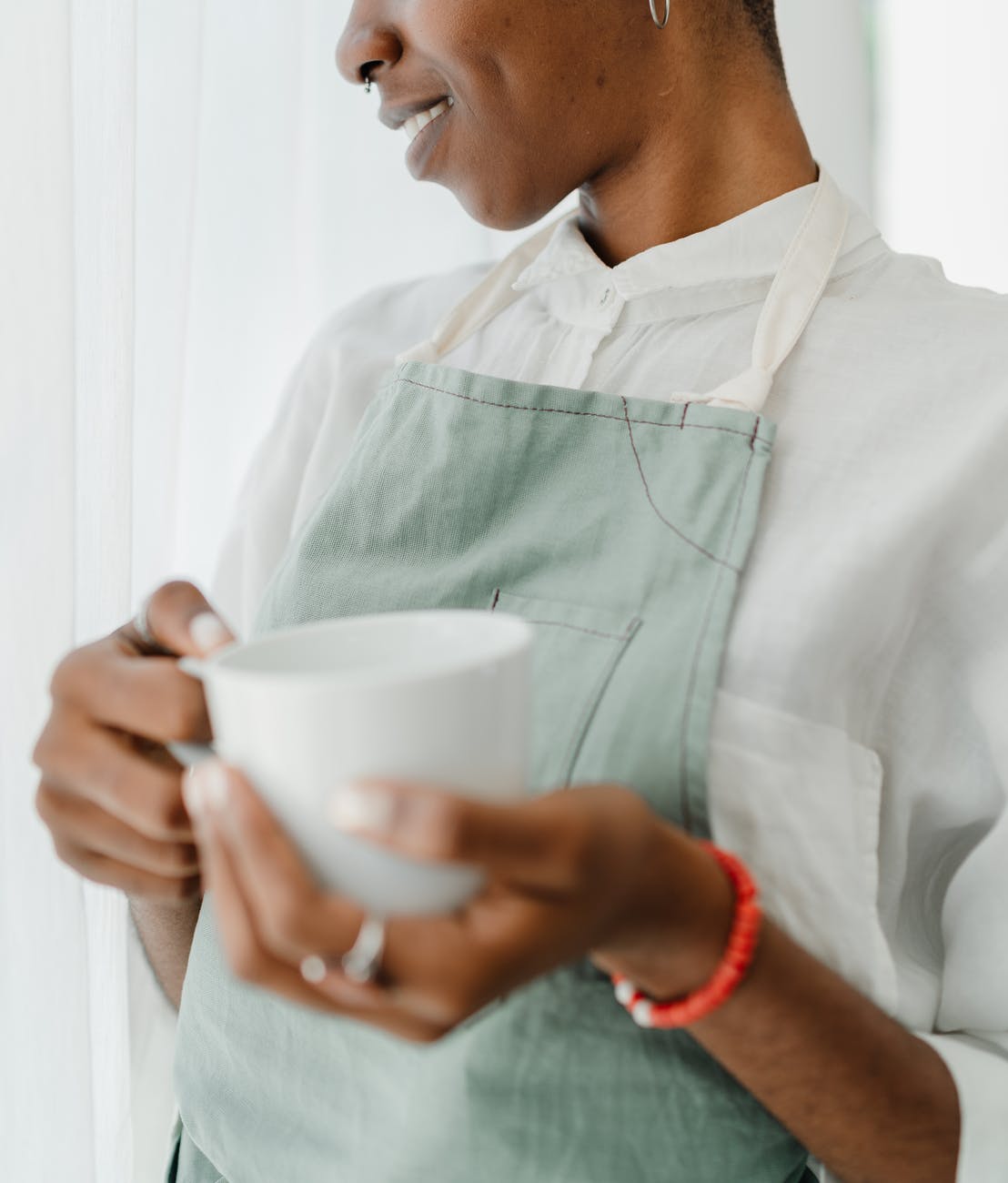 crop african american female bartender with coffee in coffee shop