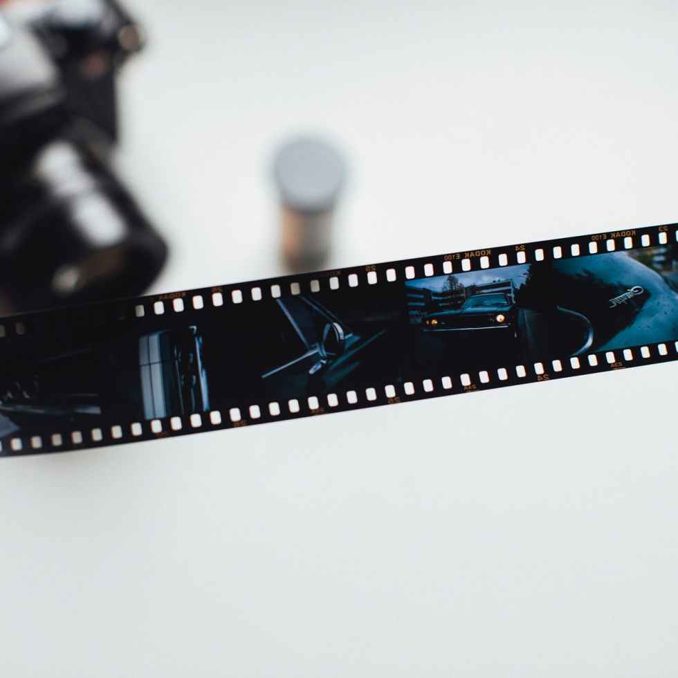 person holding film strip