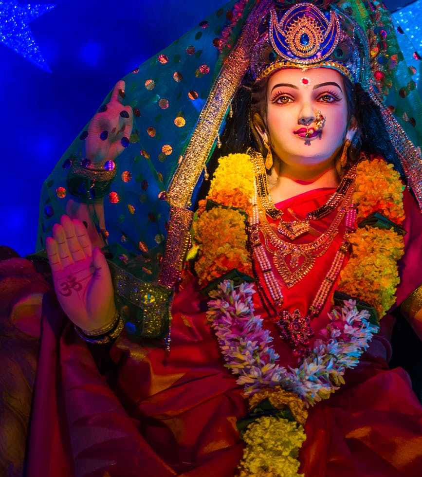 woman in red and blue floral dress