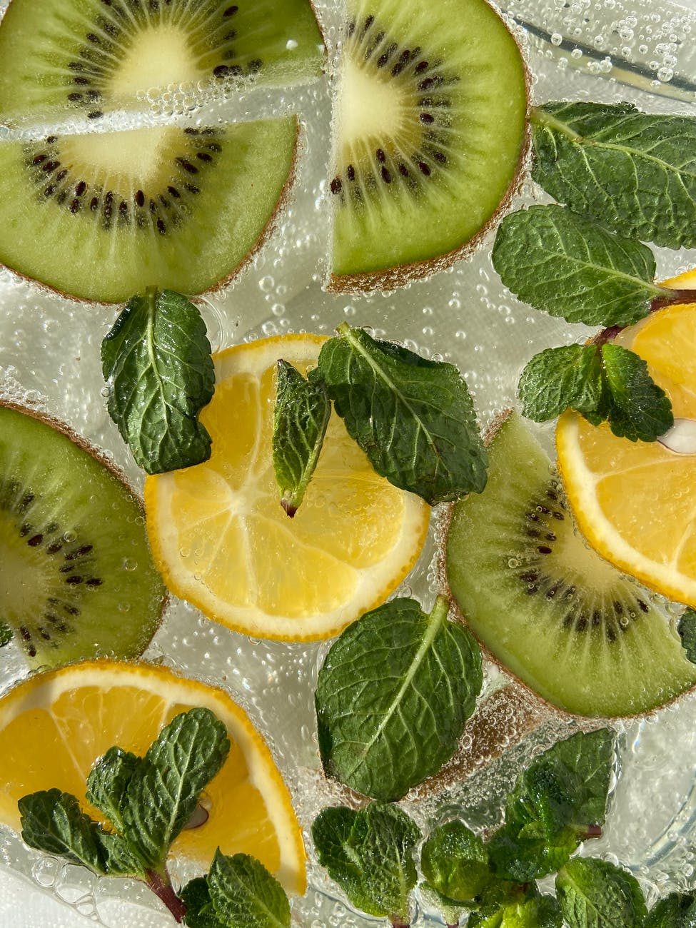 sliced lemon and kiwi in drink