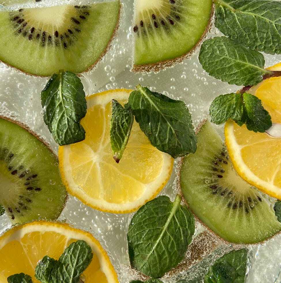 sliced lemon and kiwi in drink